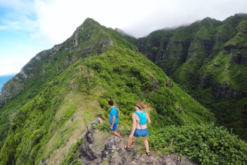Hikers on top of mountain ridge in Hawaii